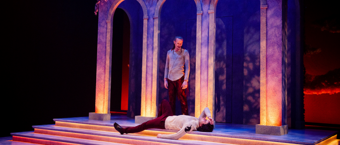 Don John (Benjamin Lewin) lays on the ground while Conrade (Danny Kelly) stands above him while they plot against the lovers in Much Ado About Nothing.