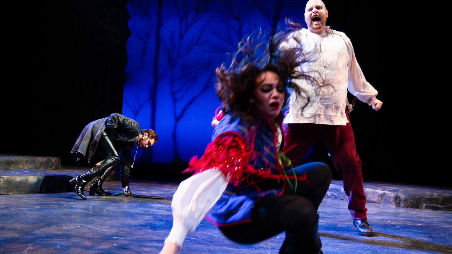 Fortenbras hits Ophelia, knocking her to the ground