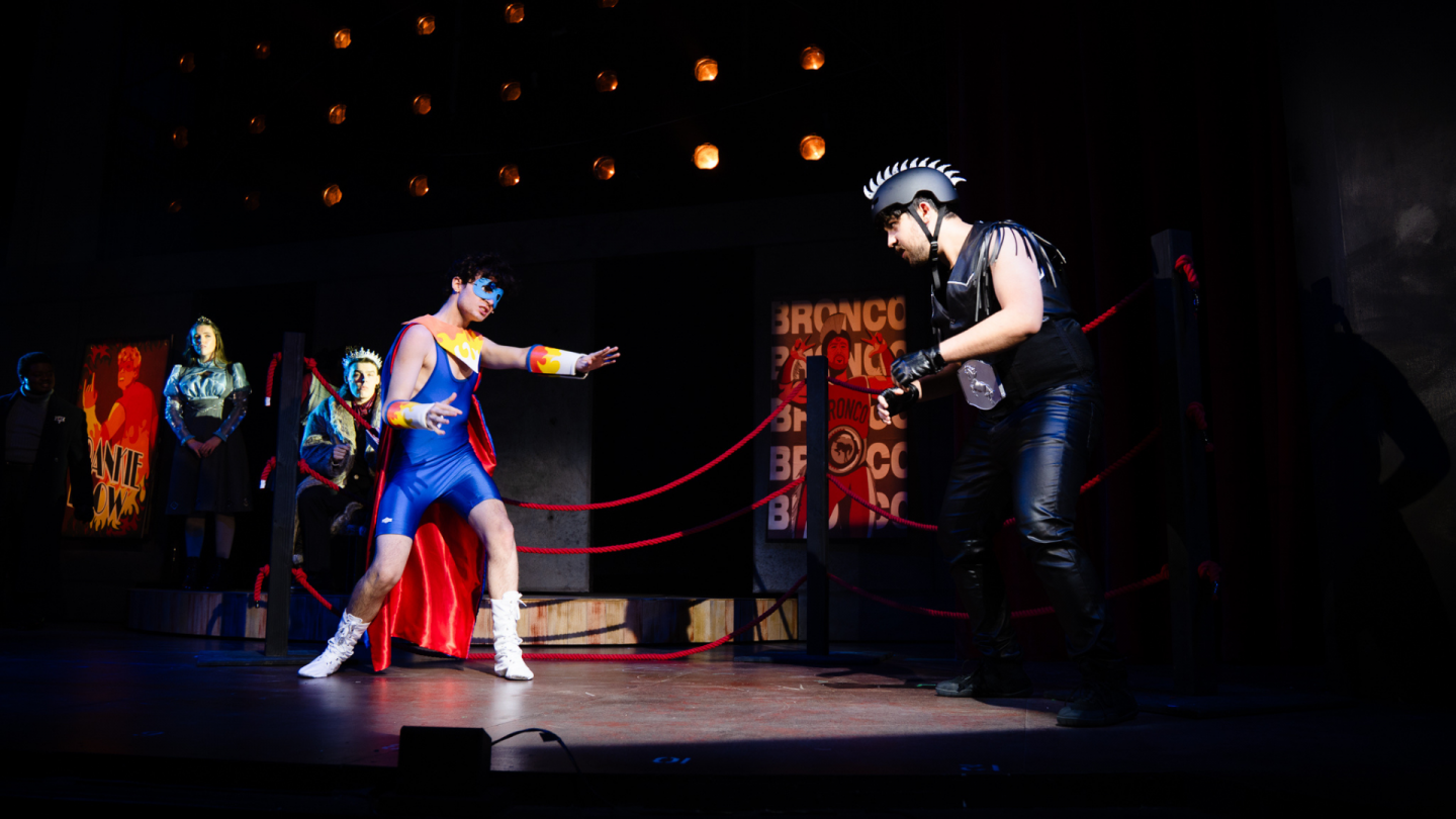 Frankie Flow enters the ring with reigning champ Bronco.