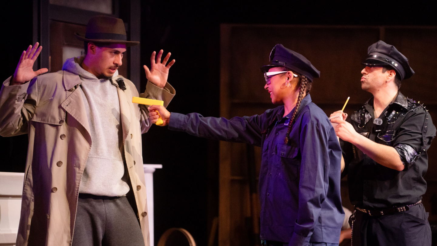 Nick Danger archive 7 In a scene from Nick Danger, Third Eye, A police officer points a toy gun at Nick Danger while another officer looks on.